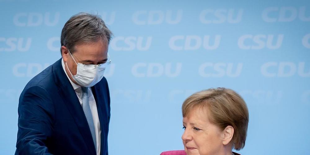 Die deutsche Bundeskanzlerin Angela Merkel und ihr möglicher Nachfolger Armin Laschet. Foto: Kay Nietfeld/dpa
