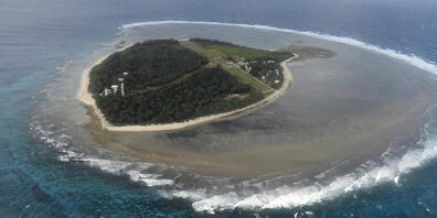 ** FILE**  A Friday, May 10, 2013 file photo shows an aerial view of Lady Elliott Island. The 45 hectares island is the southernmost coral cay of the Great Barrier Reef.  Australia's Great Barrier Reef will not be listed as endangered but will rem...