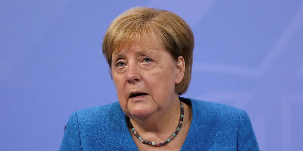 Bundeskanzlerin Angela Merkel spricht auf einer Pressekonferenz nach der Ministerpräsidentenkonferenz. Foto: Christian Mang/Reuters/Pool/dpa