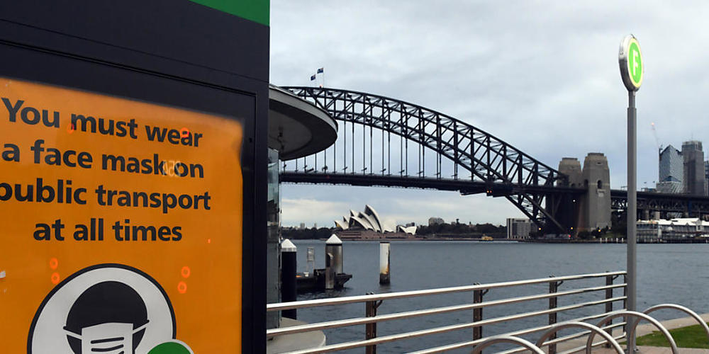 A sign warning mask wearing is seen at a ferry wharf in Sydney, Wednesday, July 28, 2021. NSW recorded 177 new locally acquired cases of COVID-19 in the 24 hours to 8pm last night. (AAP Image/Mick Tsikas) NO ARCHIVING