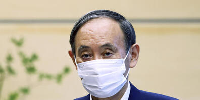 Suga wirft nach monatelanger Kritik an seinem Umgang mit der Corona-Pandemie das Handtuch. Foto: Behrouz Mehri/POOL Reuters/AP/dpa