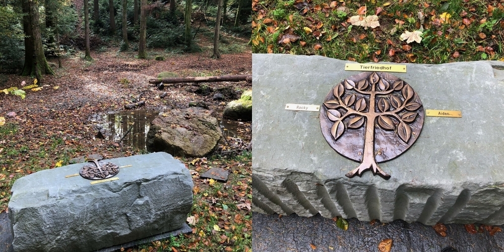 Auf der stillen Lichtung steht ein Grabstein mit den Namenschildern der bestatteten Tiere.