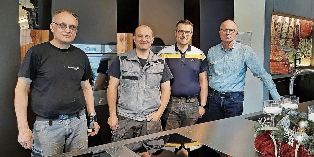 Geschäftsführer Kurt Ulmann (re.) mit seinen langjährigen Mitarbeitern