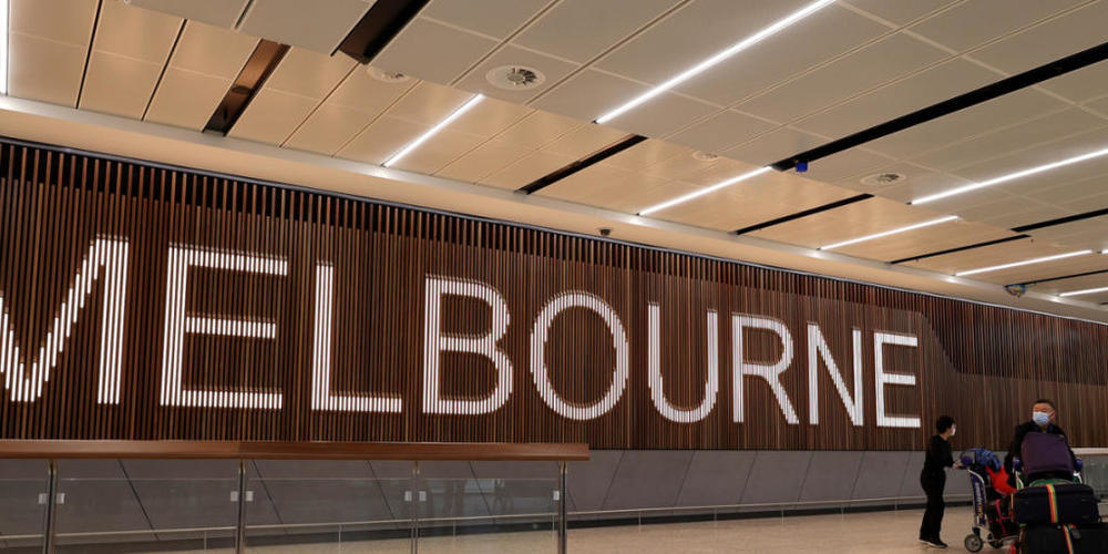 Passengers are seen arriving at Melbourne International Airport in Melbourne, Wednesday, December 15, 2021. Fully vaccinated eligible visa holders can now come to Australia without needing to apply for a travel exemption. (AAP Image/Con Chronis) N...