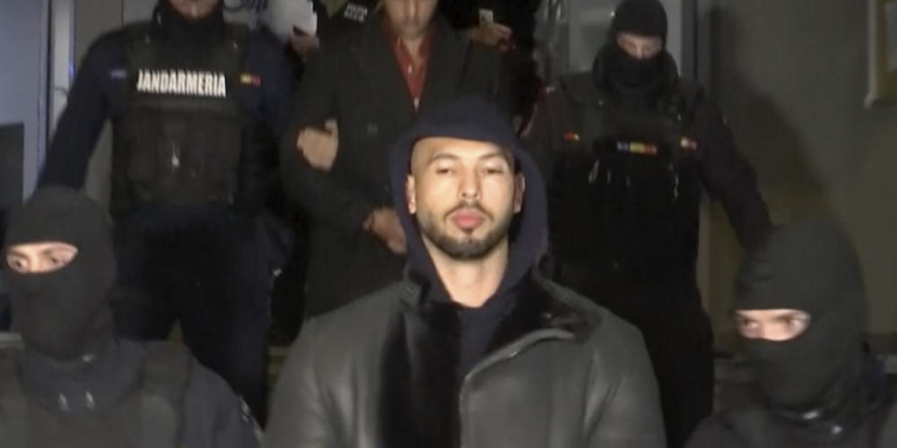 SCREENSHOT - Dieses Videostandbild des Fernsehsenders Observator Antena 1 zeigt Andrew Tate (M) bei seiner Festnahme durch die rumänische Polizei. Der britisch-amerikanische Influencer Andrew Tate ist in Rumänien wegen Verdachts auf Vergewaltigung...
