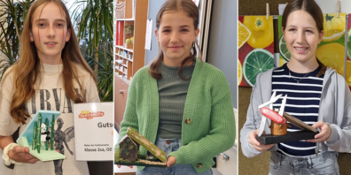 Gianna Weder, Lena Trailovic und Leonie Mock präsentieren ihre siegreichen Handyhalterungen.