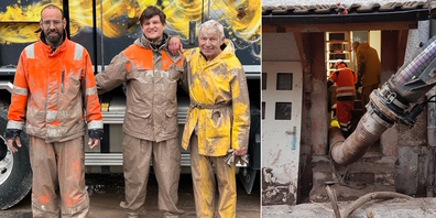 Zivilschützer und Freiwillige nach einem Einsatz. Führung eines Absaugschlauchs (r.) in ein Haus, während Helfer daran arbeiten, Schlamm aus Kellerräumen abzusaugen. 