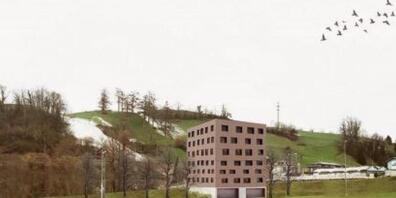 Die Visualisierung zeigt eine mögliche Geometrie des Ersatzneubaus derAsylunterkunft beim hinteren Teil der Sportanlage Luterbach in Küssnacht.