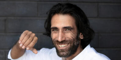 ARCHIV - Der kurdisch-iranische Journalist und Schriftsteller Behrouz Boochani. Foto: Martin Hunter/AAP/dpa