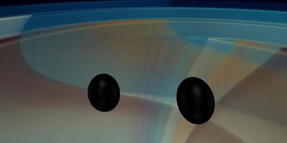 Computersimulation https://youtu.be/zRmwtL6lvIM: Zwei Schwarze Löcher umkreisen sich und stürzen ineinander.