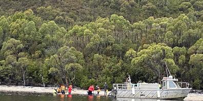 A supplied image of stranded whales along the coastline near the remote west coast town of Strahan on the island state of Tasmania, Australia. Friday, September 25, 2020. More pilot whales were found stranded on an Australian coast Wednesday, rais...