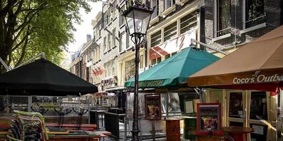 Geschlossene Restaurants in der Amsterdamer Innenstadt. Foto: Robin Van Lonkhuijsen/ANP/dpa
