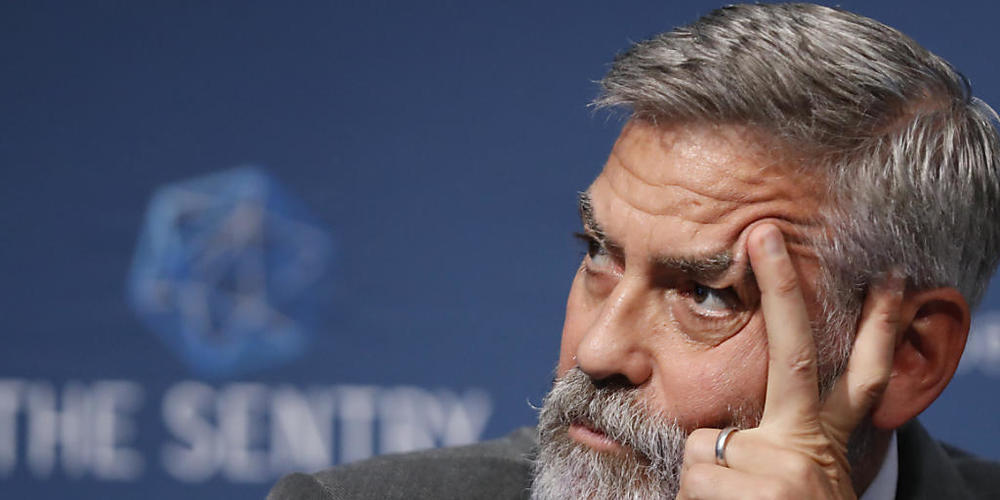 ARCHIV - George Clooney, Schauspieler und Aktivist aus den USA, spricht bei einer Pressekonferenz. Foto: Alastair Grant/AP/dpa