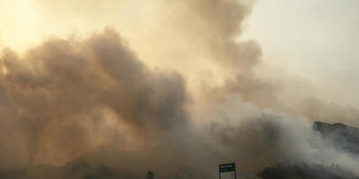 A supplied image obtained on Monday, December 7, 2020, the K'gari (Fraser Island) bushfire seen outside the Cathedrals camping ground, on Fraser Island. TA dangerous bushfire is within a few hundred metres of Happy Valley as dozens of firefighters...