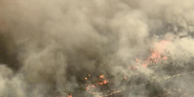 A screengrab obtained December 2, 2020 of aerial footage of the K'gari (Fraser Island) fire captured on Monday 30 November 2020. Tourists have been ordered to stay away from Queensland's world heritage-listed Fraser Island as a massive bushfire co...