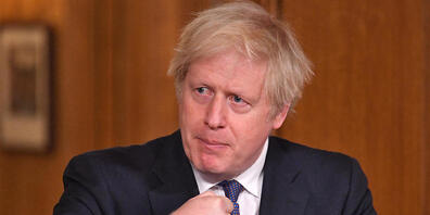 Boris Johnson, Premierminister von Großbritannien, gestikuliert in der Downing Street bei einer Pressekonferenz zur Corona-Pandemie. Foto: Dominic Lipinski/PA Wire/dpa