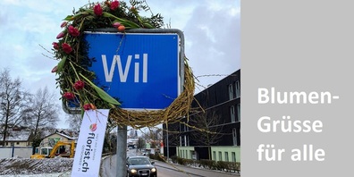 rosa braun by Blumen Nützi hat drei Ortstafeln der Stadt Wil für den heutigen Tag geschmückt.