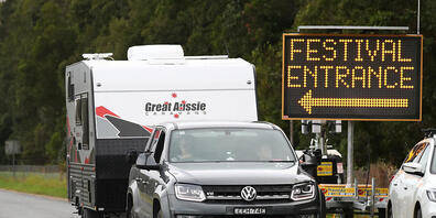 Festival goers leave the Bluesfest site after it was cancelled, Wednesday, March 31, 2021. A new locally-acquired COVID-19 case has been uncovered in northern NSW, prompting new restrictions on four councils and the cancellation of Bluesfest. (AAP...